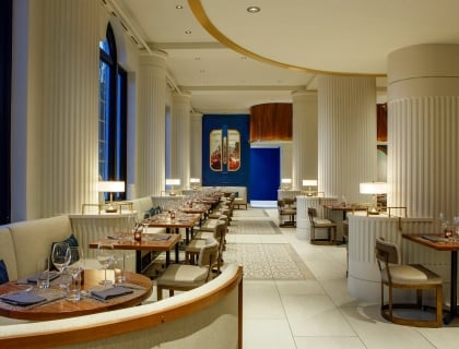 dining room with large white columns and blue walls