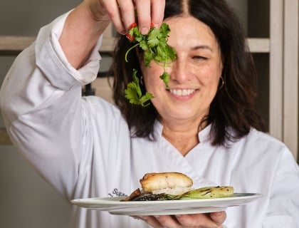Chef Susan garnishing a dish
